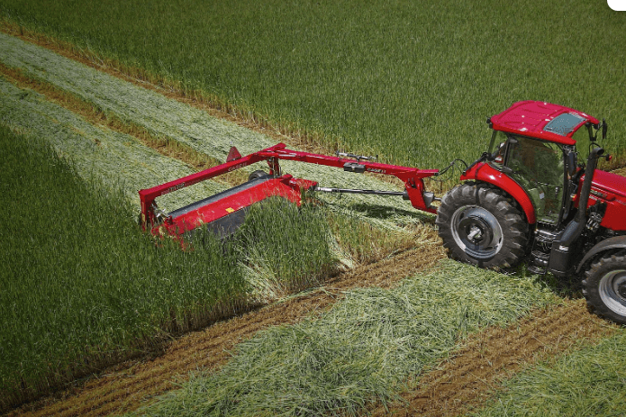 Case IH Tractor mowing down tall grass