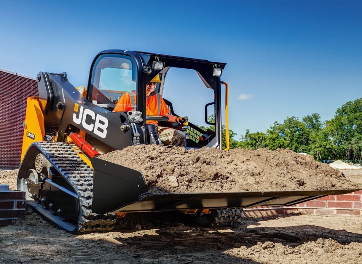 JCB Compact Track Loader hauling dirt